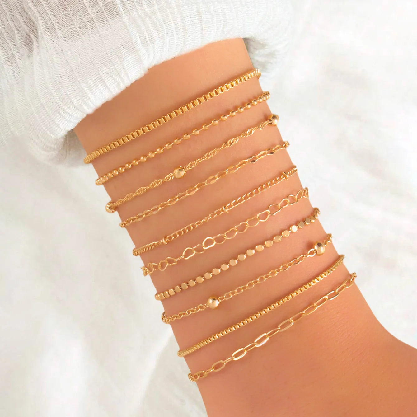Solara – 10-Piece Layered Gold Bracelet Set